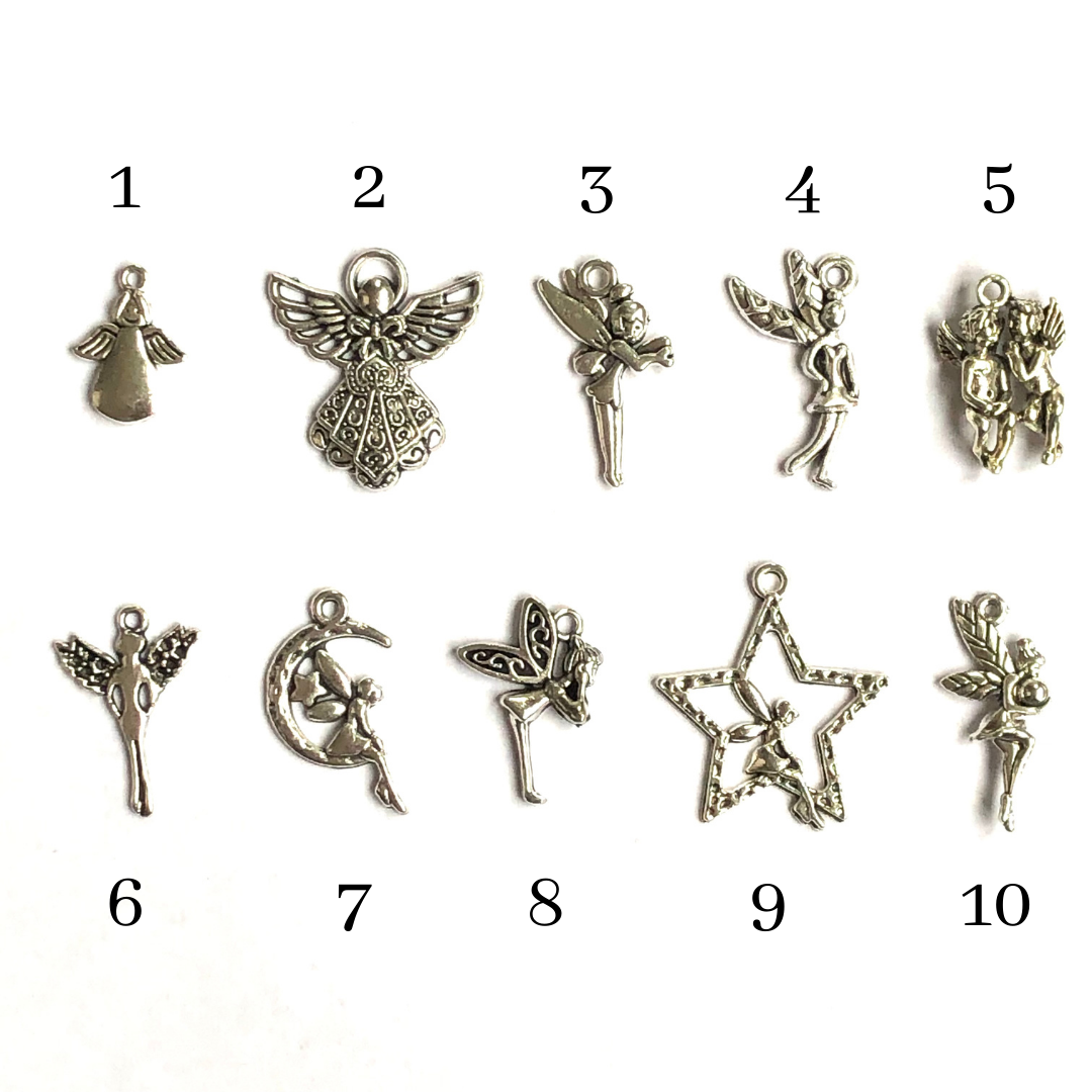 Assortment of fairy and angel charms, labelled from 1 to 10.