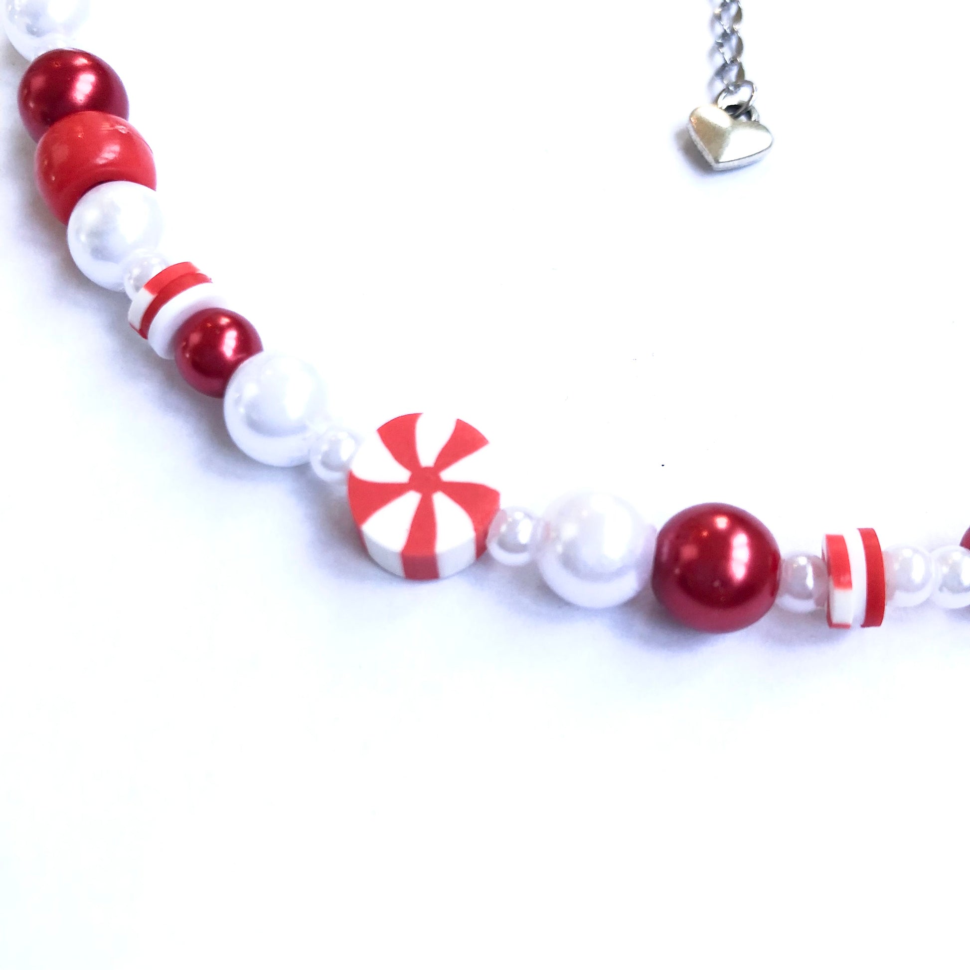 Close-up of a red and white peppermint bead.