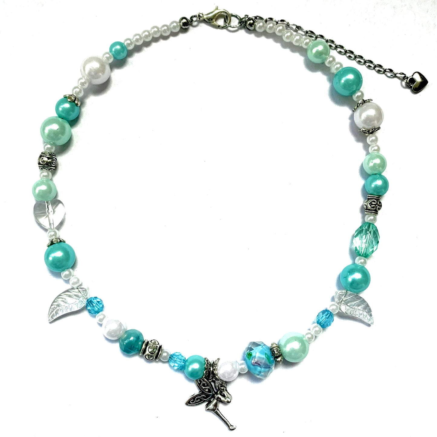 Turquoise and white glass bead necklace with a fairy charm.