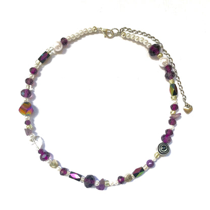 Iridescent deep purple and black glass bead necklace.