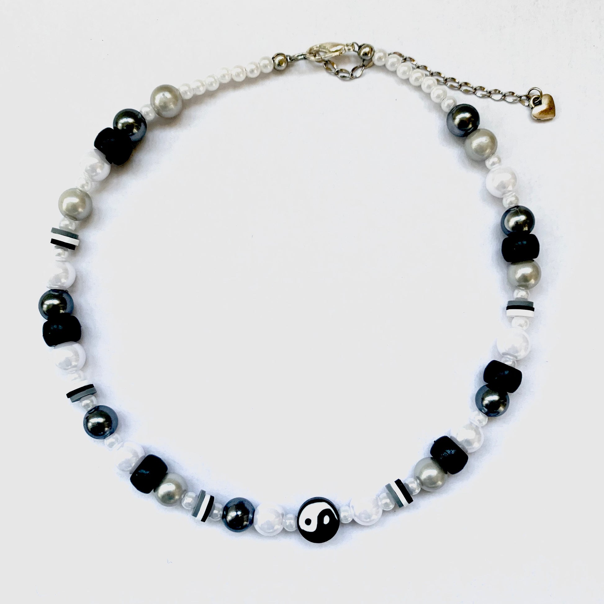 Beaded black yin and yang necklace with faux white and black pearls.