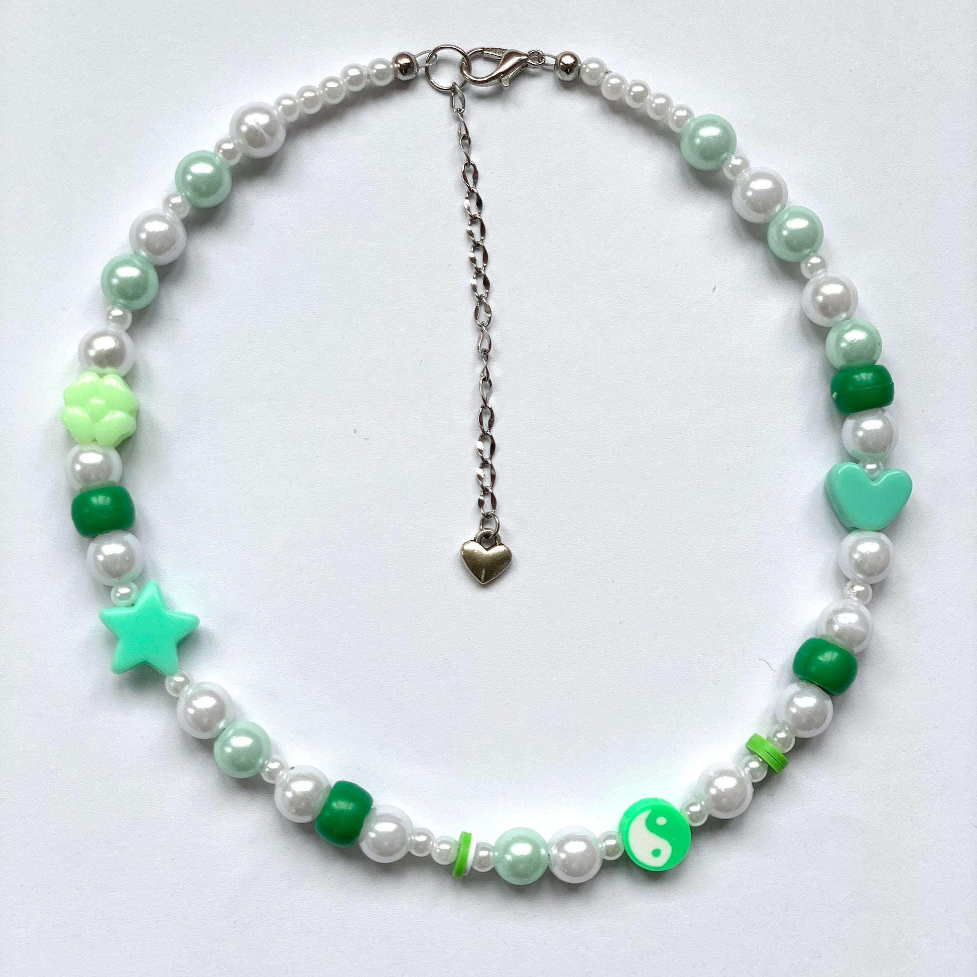 Beaded green yin and yang necklace with faux white and green pearls.