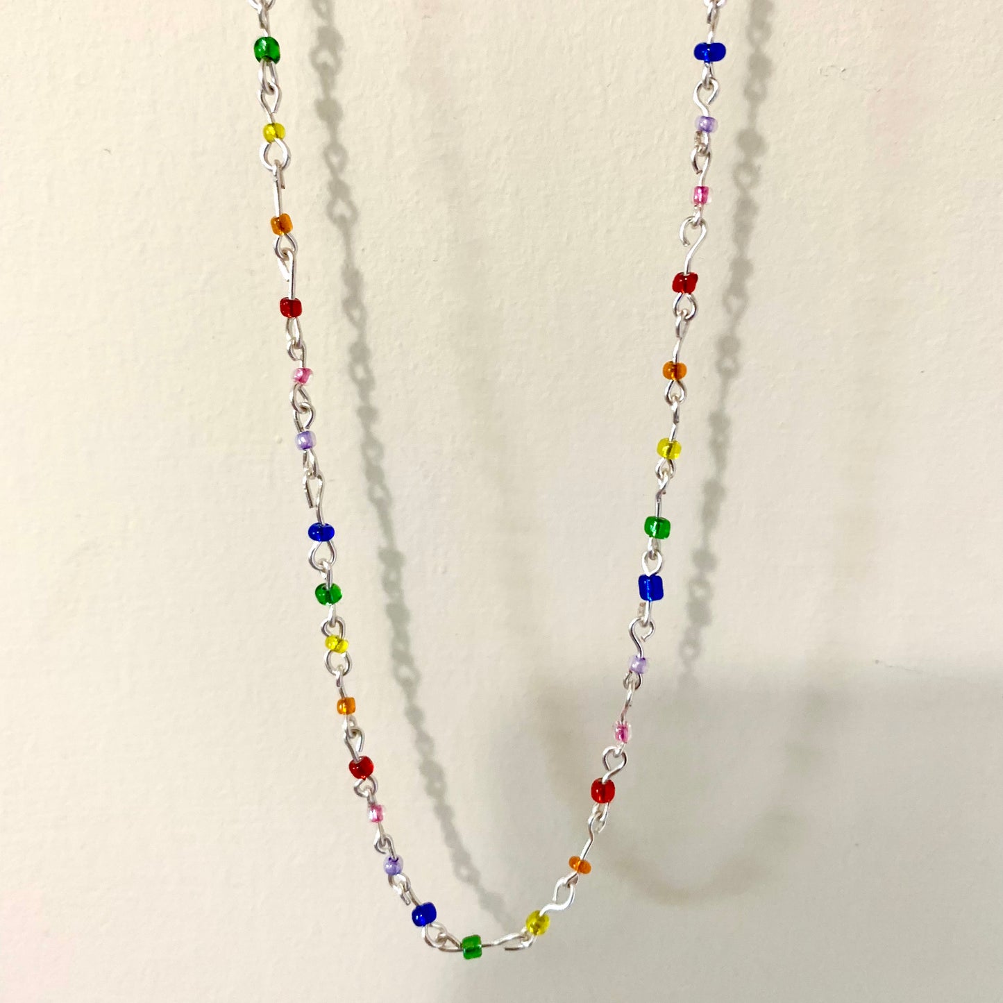 Beaded rainbow seed bead wire necklace.